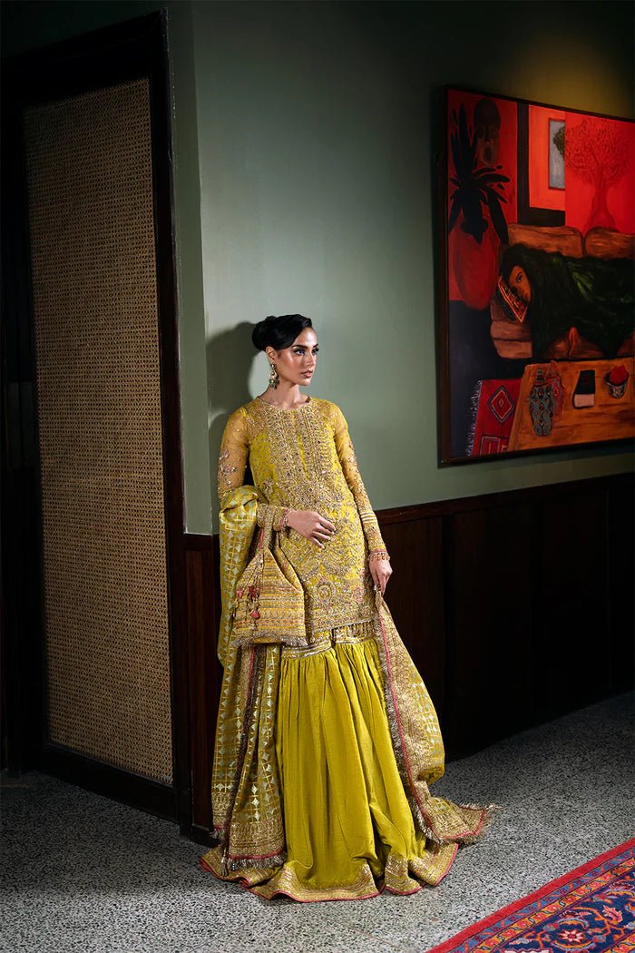 Model wearing Saira Rizwan Festive Formals '24 SERA - SRF - D - 08, a mustard yellow embellished outfit with traditional design, ideal for weddings. Available as Pakistani clothes online in the UK.