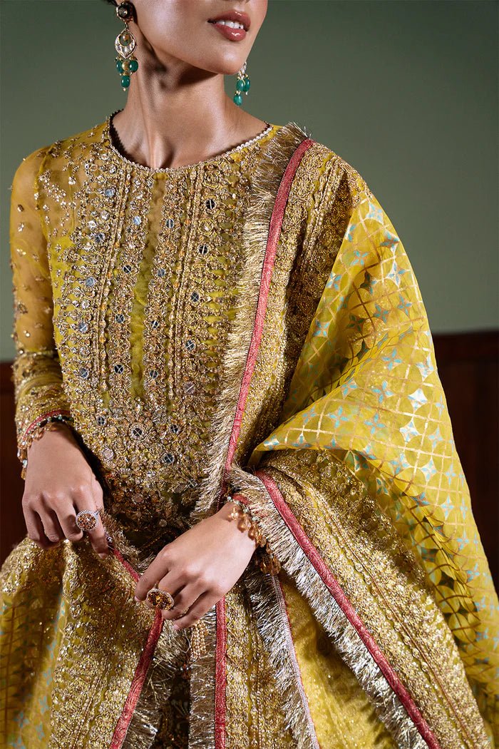 Model wearing Saira Rizwan Festive Formals '24 SERA - SRF - D - 08, a mustard yellow embellished outfit with traditional design, ideal for weddings. Available as Pakistani clothes online in the UK.