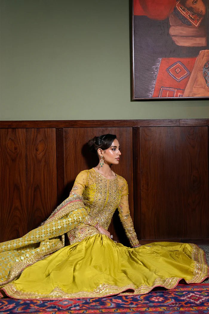 Model wearing Saira Rizwan Festive Formals '24 SERA - SRF - D - 08, a mustard yellow embellished outfit with traditional design, ideal for weddings. Available as Pakistani clothes online in the UK.