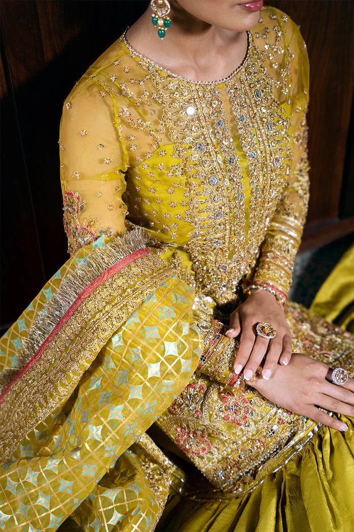 Model wearing Saira Rizwan Festive Formals '24 SERA - SRF - D - 08, a mustard yellow embellished outfit with traditional design, ideal for weddings. Available as Pakistani clothes online in the UK.