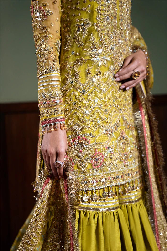 Model wearing Saira Rizwan Festive Formals '24 SERA - SRF - D - 08, a mustard yellow embellished outfit with traditional design, ideal for weddings. Available as Pakistani clothes online in the UK.