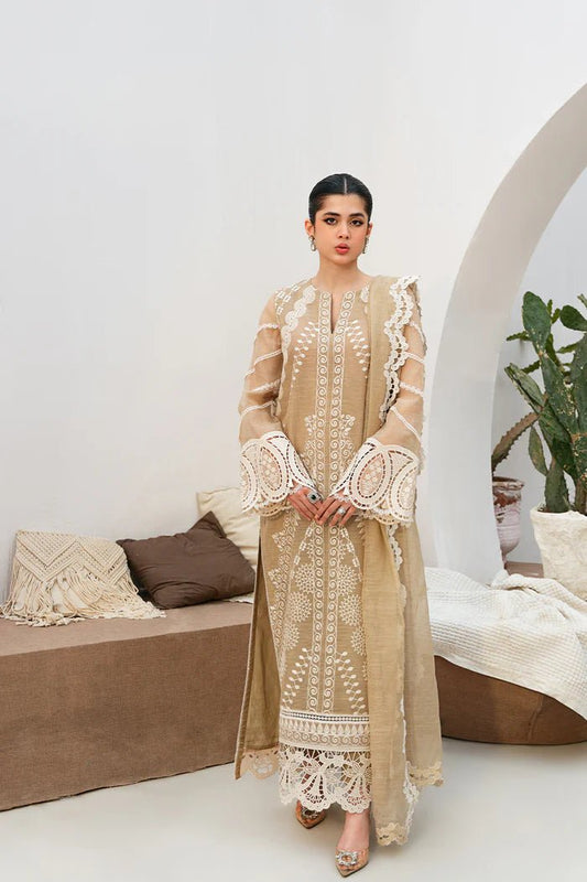 Model wearing Saira Rizwan Mira dress, traditional Pakistani clothes UK, beige formal wear.