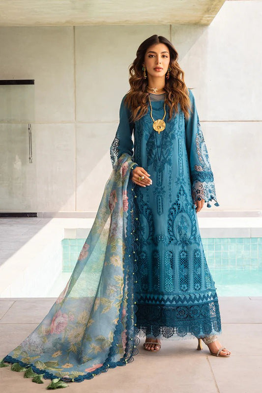 Model wearing Saira Rizwan SAPPHIRE blue lace dress, Pakistani luxury lawn '24 in UK.