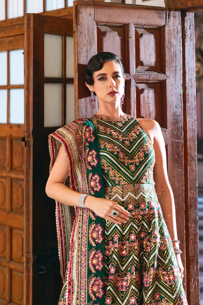 Model wearing SRN24 - 06 PENELOPE green and pink embroidered dress from Saira Rizwan. Shop Saira Rizwan's Pakistani clothes online in the UK for elegant wedding clothes.