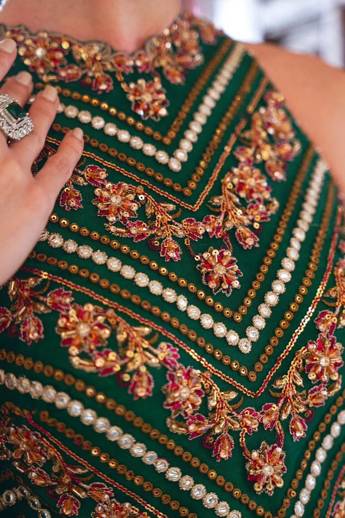 Model wearing SRN24 - 06 PENELOPE green and pink embroidered dress from Saira Rizwan. Shop Saira Rizwan's Pakistani clothes online in the UK for elegant wedding clothes.