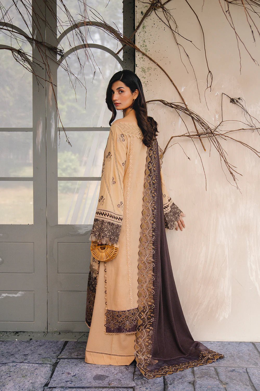 Model wearing NERIA - SRW24 - 07 from Saira Rizwan's Winter Unstitched '24 Collection with elegant patterns. Pakistani clothes online in UK.