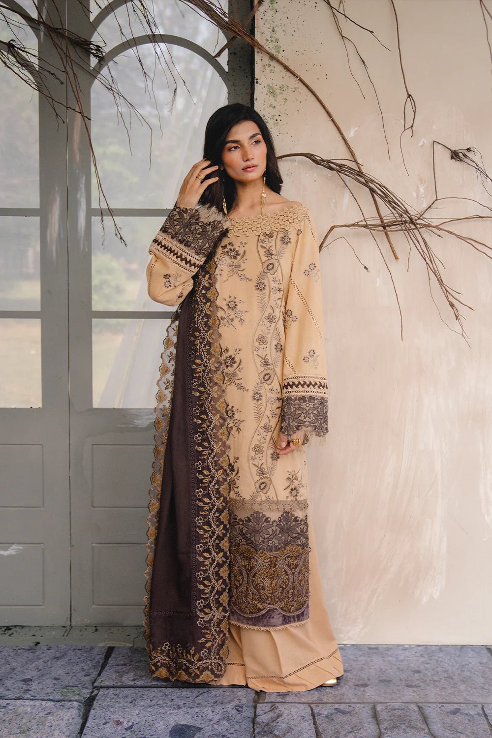 Model wearing NERIA - SRW24 - 07 from Saira Rizwan's Winter Unstitched '24 Collection with elegant patterns. Pakistani clothes online in UK.