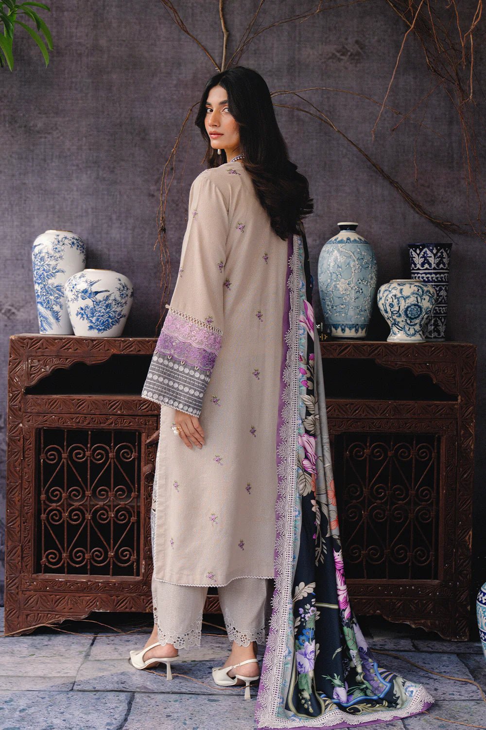 Model wearing REVE - SRW24 - 06 from Saira Rizwan's Winter Unstitched '24 Collection with intricate detailing. Pakistani clothes online in UK.