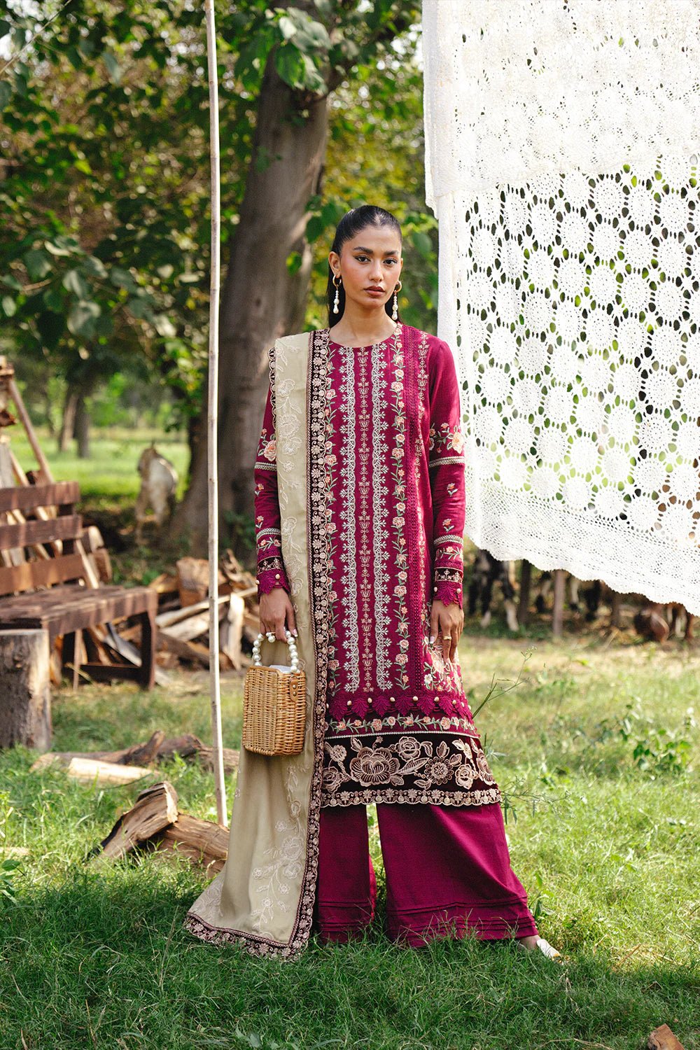 Model wearing SANSA - SRW24 - 09 from Saira Rizwan's Winter Unstitched '24 Collection with elegant details. Pakistani clothes online in UK.