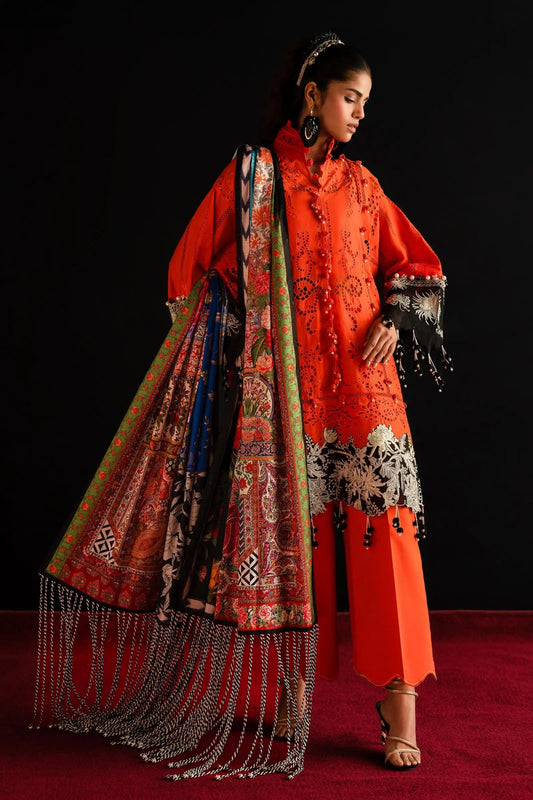 Model showcases Sana Safinaz's L241 - 001A - 3CL vibrant orange Pakistani dress, a UK luxury collection piece.