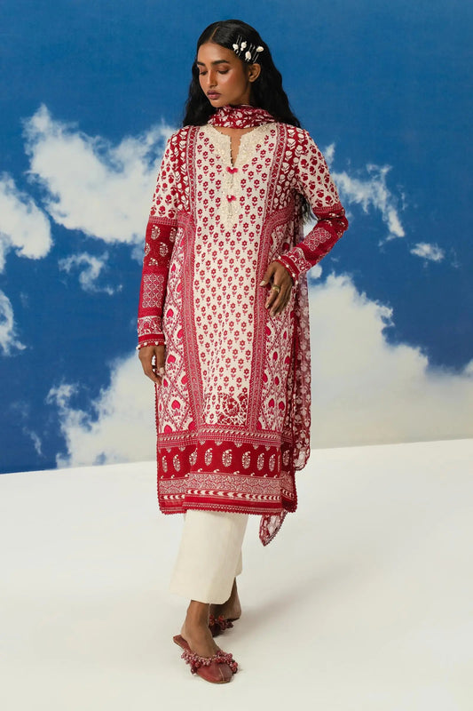 Model wearing Sana Safinaz Mahay'24 red patterned lawn suit, designer summer dress from Pakistan in UK.