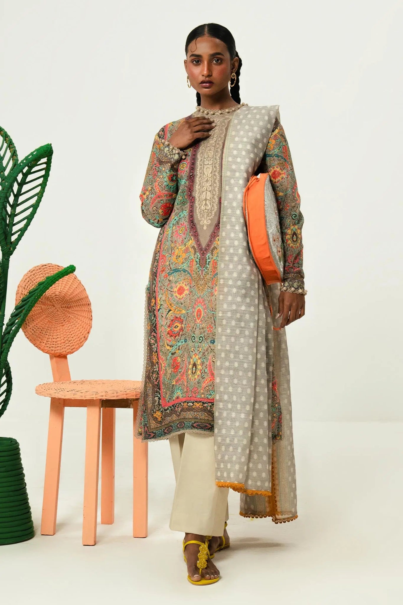 Model wearing Sana Safinaz Mahay'24 grey multi - colored lawn suit, luxury summer outfit in UK.