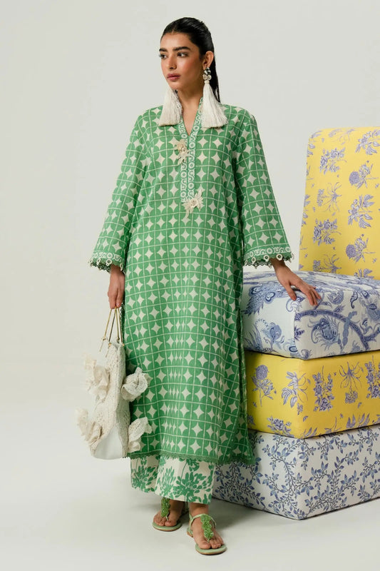 Model wearing Sana Safinaz Mahay'24 green geometric pattern lawn suit, fresh pakistani designer wear in UK.