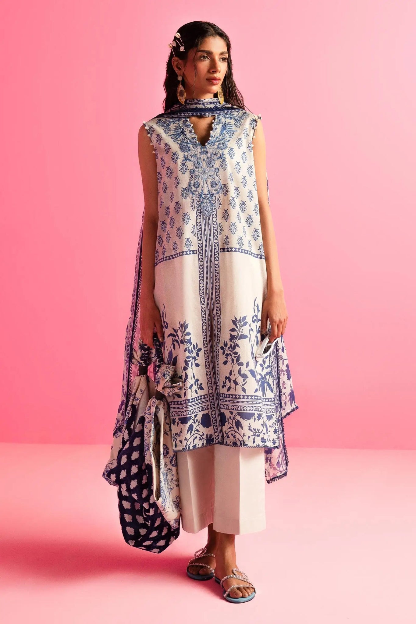 Model wearing Sana Safinaz Mahay'24 cream and blue printed lawn suit, trendy Pakistani fashion in UK.