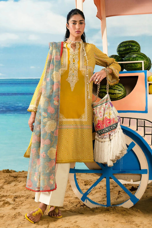 Model wearing Sana Safinaz Mahay'24 yellow lawn suit with intricate embroidery, summer dress perfect for UK Pakistani clothes collection.