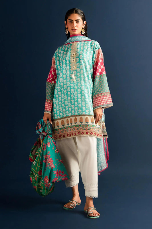 Model wearing Sana Safinaz turquoise and pink lawn dress, Pakistani summer fashion in the UK.