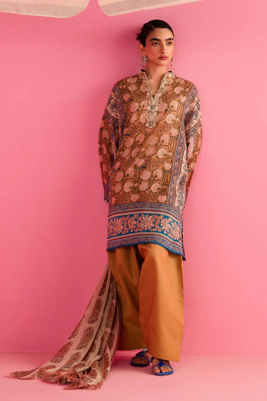 Model wearing Sana Safinaz H242 - 024B - 3CI beige Pakistani lawn suit with mustard trousers and dupatta.