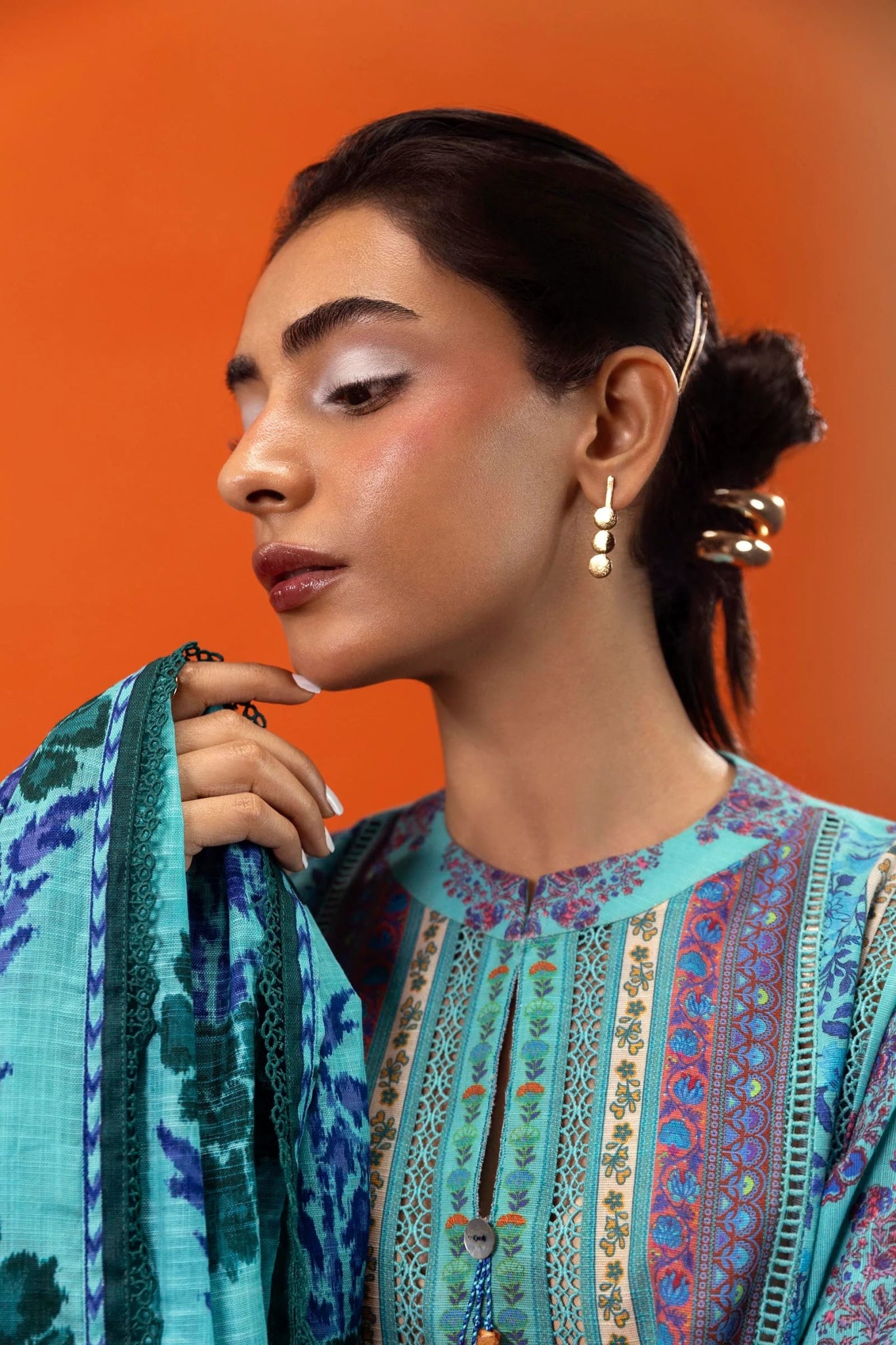 Model wearing Sana Safinaz Mahay Winter '24, showcasing a blue 2 - piece outfit with intricate printing om khaddar, ideal for winter casual pret. Available online in the UK.