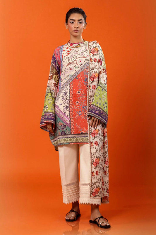 Model wearing a two - piece Sana Safinaz suit from Mahay Winter '24 featuring a digitally printed linen shirt with vibrant floral and geometric patterns, paired with a coordinating rotary printed linen dupatta. Available online in the UK.