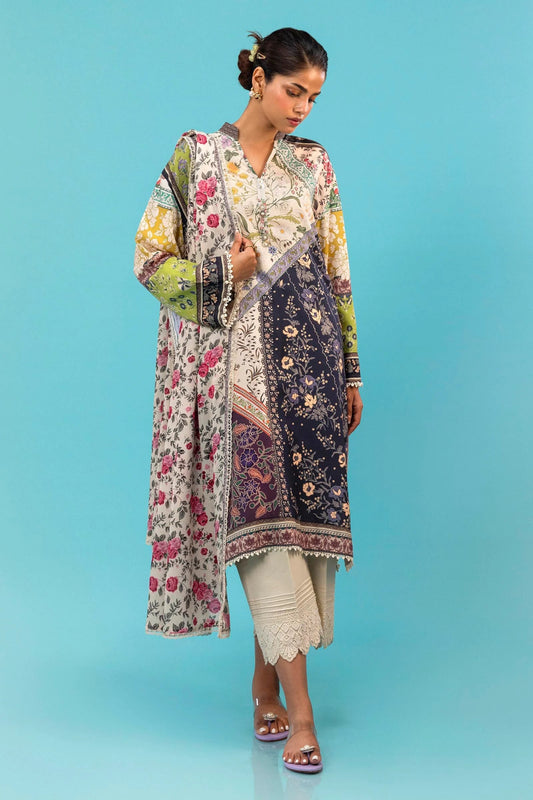 Model wearing a two - piece Sana Safinaz suit from the Mahay Winter '24 collection, featuring a digitally printed linen shirt with mixed floral and geometric patterns, paired with a coordinating rotary printed linen dupatta. Available online in the UK.