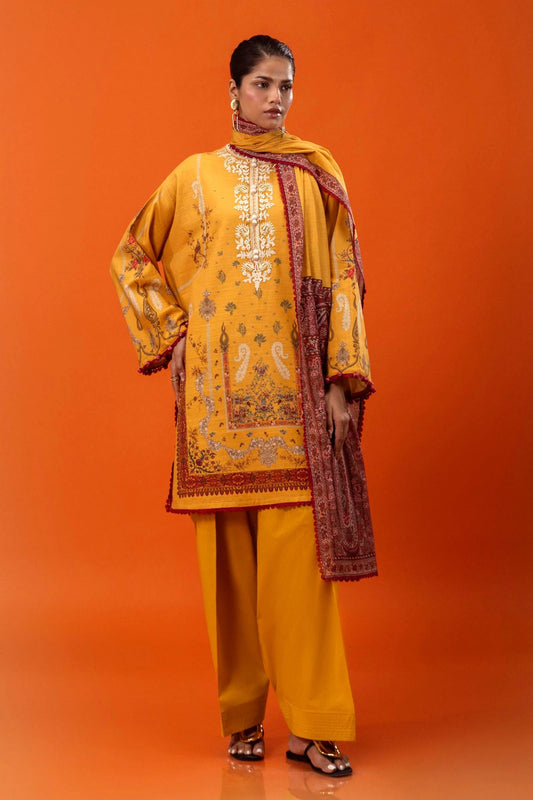 A model wears a three - piece outfit from Sana Safinaz’s Mahay Winter '24 collection. The outfit includes a digitally printed front, back, and sleeves on slub fabric, accented with an embroidered organza neckline. Paired with dyed cambric pants and a digitally printed khaddar dupatta, this ensemble offers a complete, elegant look. Available online in the UK for £64.00.