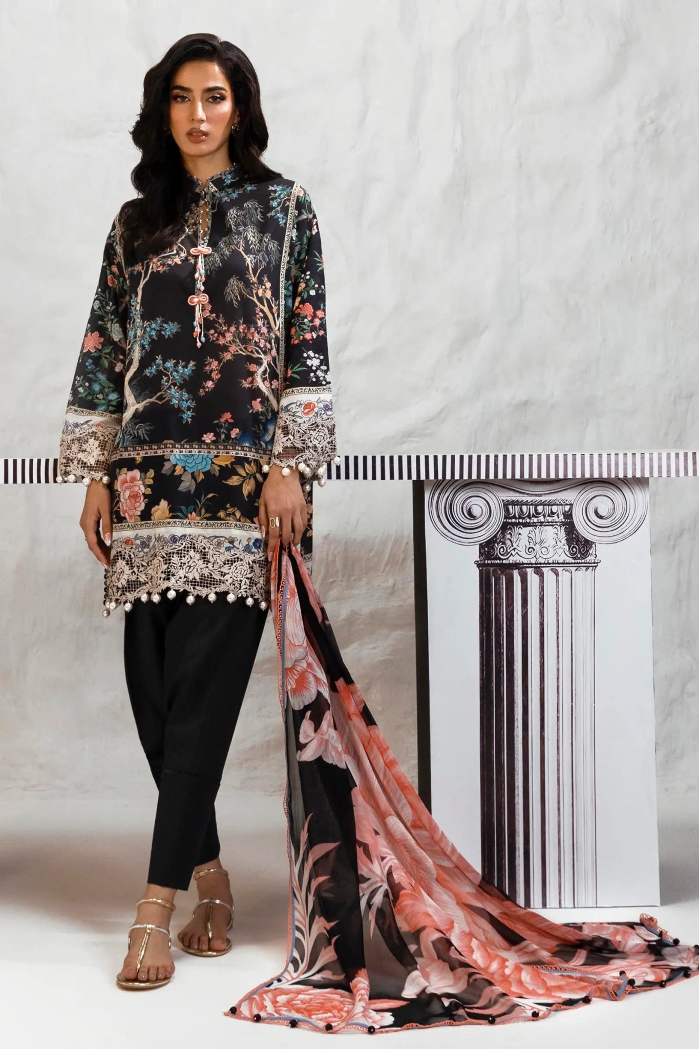 Model wearing Sana Safinaz M242 - 001B - CI black floral dress with lace details and a colorful dupatta, ideal for Pakistani designer clothes in UK, readymade lawn suits.