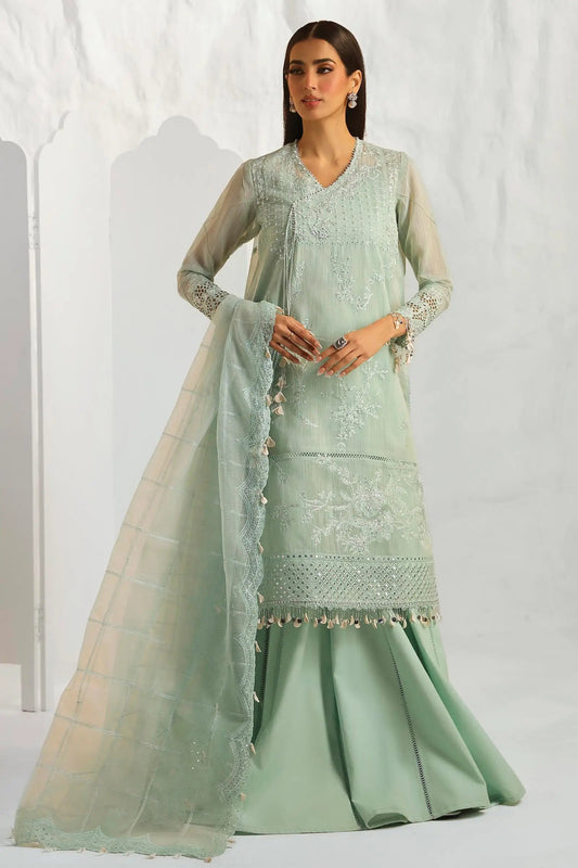 Model wearing Sana Safinaz M242 - 020B - CV mint green dress from the Muzlin Summer '24 collection, showcasing intricate embroidery and a flowing silhouette.