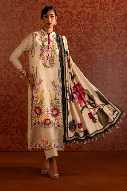 A model wears a luxurious three - piece outfit from the Sana Safinaz Muzlin Winter '24 Collection. The ensemble features intricately embroidered front kalis on slub fabric, complemented by dyed slub sleeves and back. It includes a vibrant digital printed shawl and matching dyed cotton pants, creating an elegant look perfect for women seeking stylish Pakistani designer clothing. Available online in the UK.