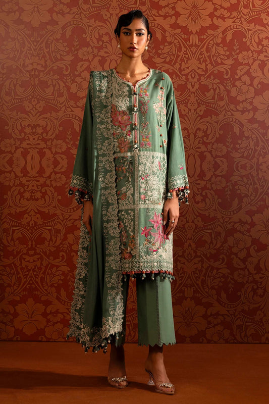 A model wears a three - piece outfit from the Sana Safinaz Muzlin Winter '24 Collection. It includes an embroidered front kali on slub fabric, complemented by a dyed slub back and intricately embroidered sleeves. The look is finished with an elegant embroidered shawl featuring detailed pallus, and dyed cotton pants, creating a refined and cohesive ensemble. Ideal for those seeking luxurious Pakistani fashion. Available online.