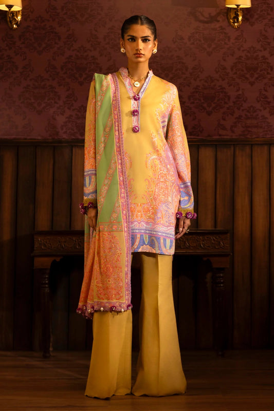 Model wearing a 3 - piece vibrant yellow suit featuring a digitally printed linen front, back, and sleeves, paired with a colorful printed dupatta. Styled with dyed cotton pants for a bold look. Part of the Sana Safinaz Muzlin Winter 2024 collection, available online in the UK.