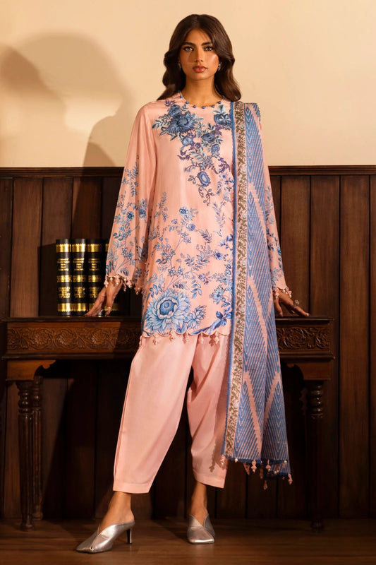 Model wearing a 3 - piece pink suit featuring a digitally printed linen front, back, and sleeves with blue floral patterns. Styled with an embroidered organza daman, a printed khaddar dupatta, and dyed cotton pants for a chic look. Part of the Sana Safinaz Muzlin Winter 2024 collection, available online in the UK.