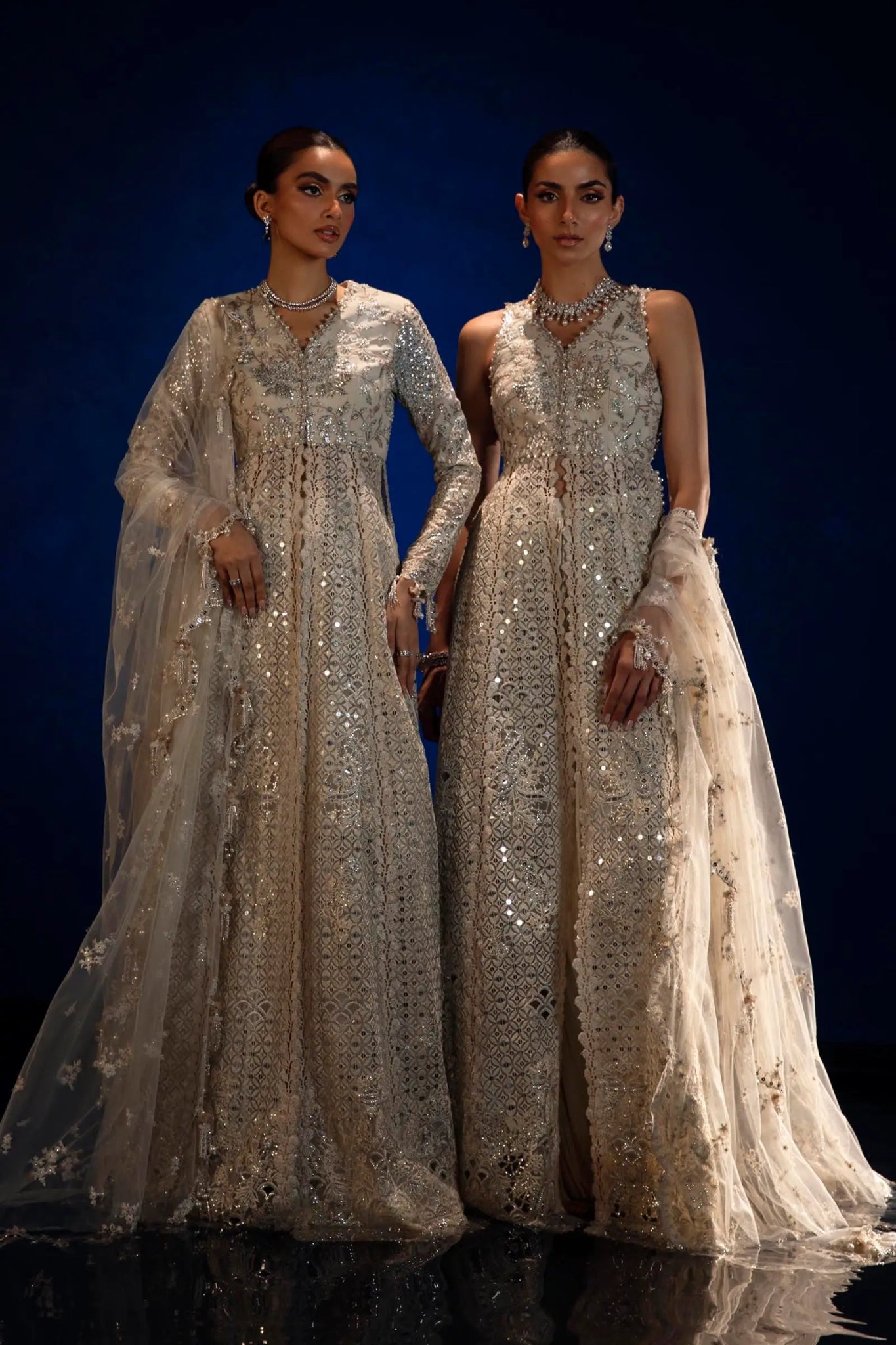 Model in Sana Safinaz silver NURA gown showcasing opulent Pakistani fashion in the UK.