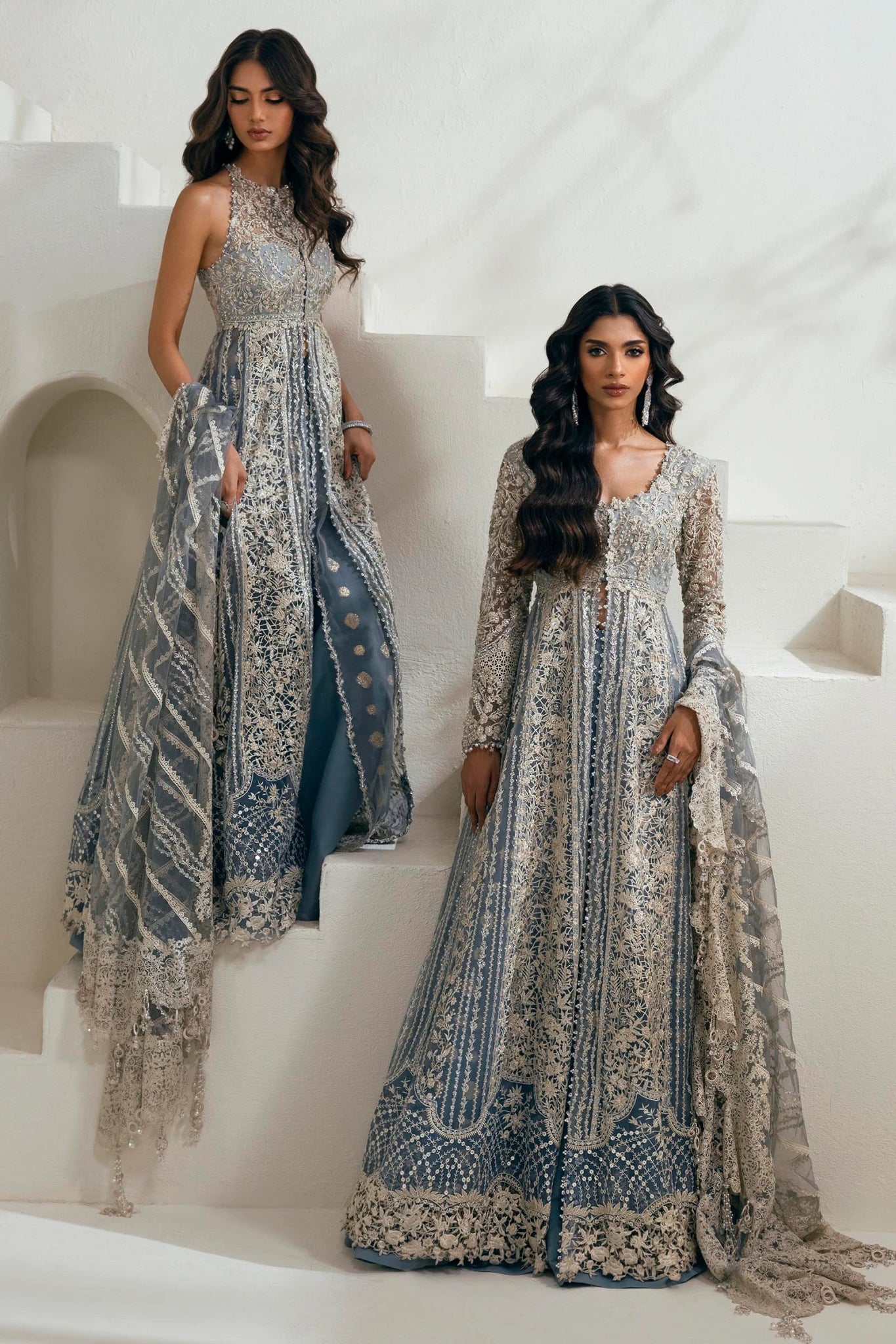 Model wearing N242 - 004 - 3CT dress from Sana Safinaz in a stunning blue color with intricate silver embroidery. Pakistani wedding clothes, available online in the UK.