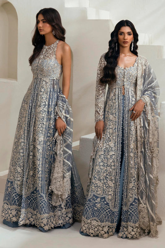 Model wearing N242 - 004 - 3CT dress from Sana Safinaz in a stunning blue color with intricate silver embroidery. Pakistani wedding clothes, available online in the UK.