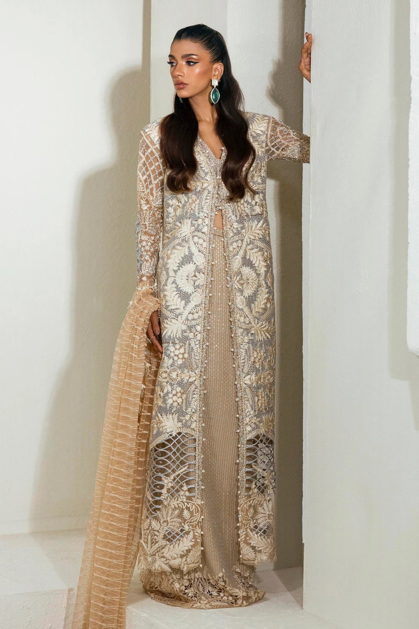 Model wearing an elegant N242 - 005 - 3CT dress in beige and gold from Sana Safinaz's NURA Festive '24 Vol. II collection. Available for Pakistani clothes online in UK, perfect for wedding clothes.