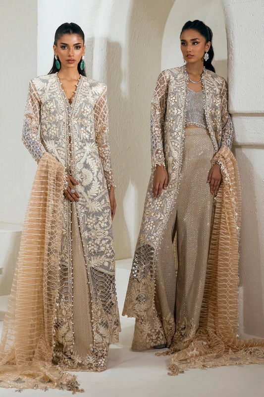 Model wearing an elegant N242 - 005 - 3CT dress in beige and gold from Sana Safinaz's NURA Festive '24 Vol. II collection. Available for Pakistani clothes online in UK, perfect for wedding clothes.