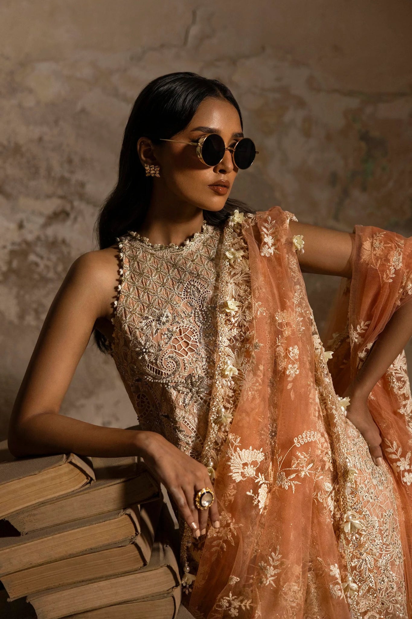 Model in a luxurious Sana Safinaz Nura Vol. 3 2024 peach outfit with hand - embellished georgette, embroidered net dupatta, and raw silk trousers, perfect for formal events. Available online in the UK.