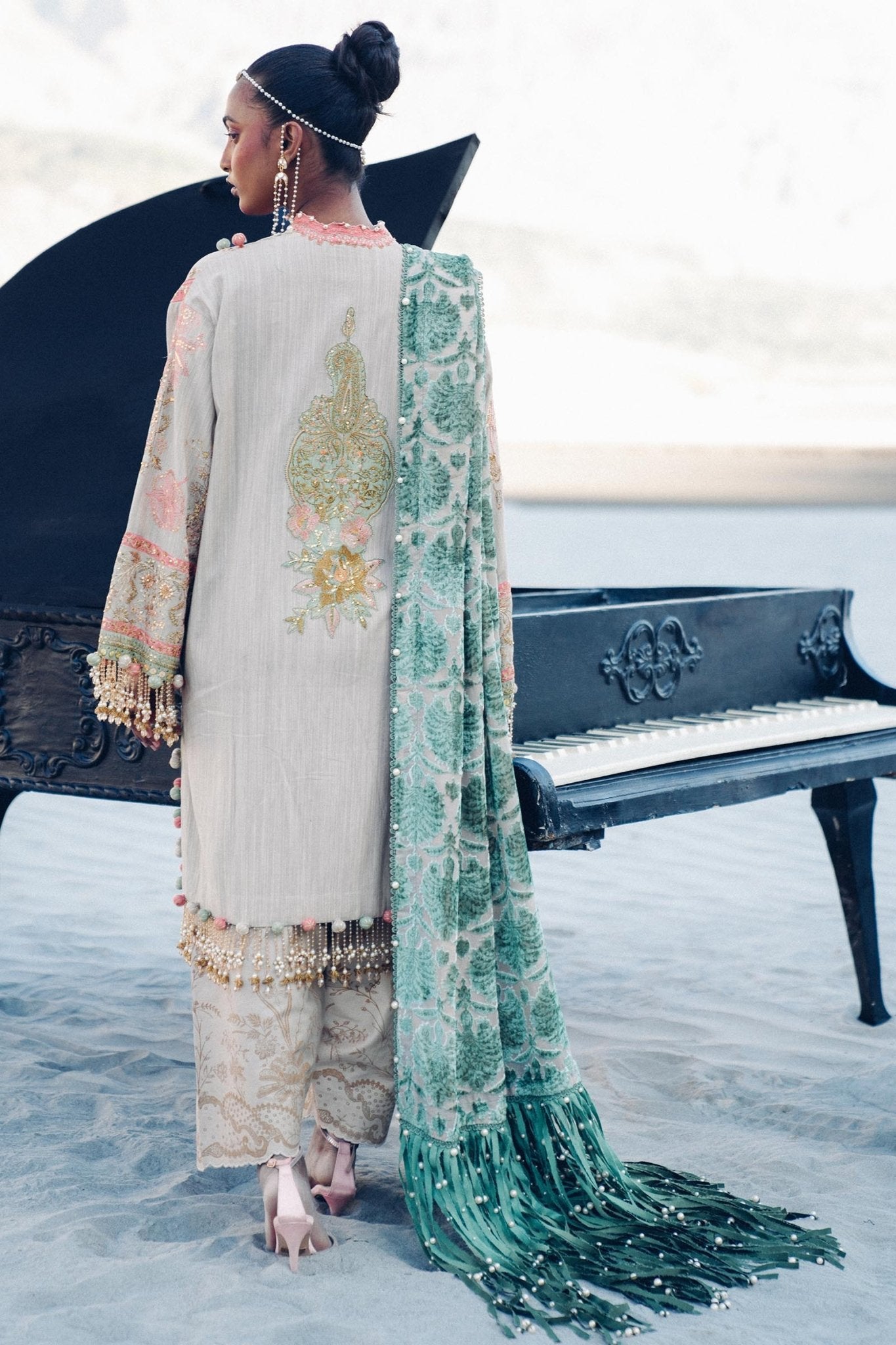 Model wearing Sana Safinaz Winter Luxury '24 S241 - 001B - 3CP, a pastel ensemble with intricate embroidery, green velvet shawl, and beaded accents. Perfect for winter, available for Pakistani clothes online in the UK.