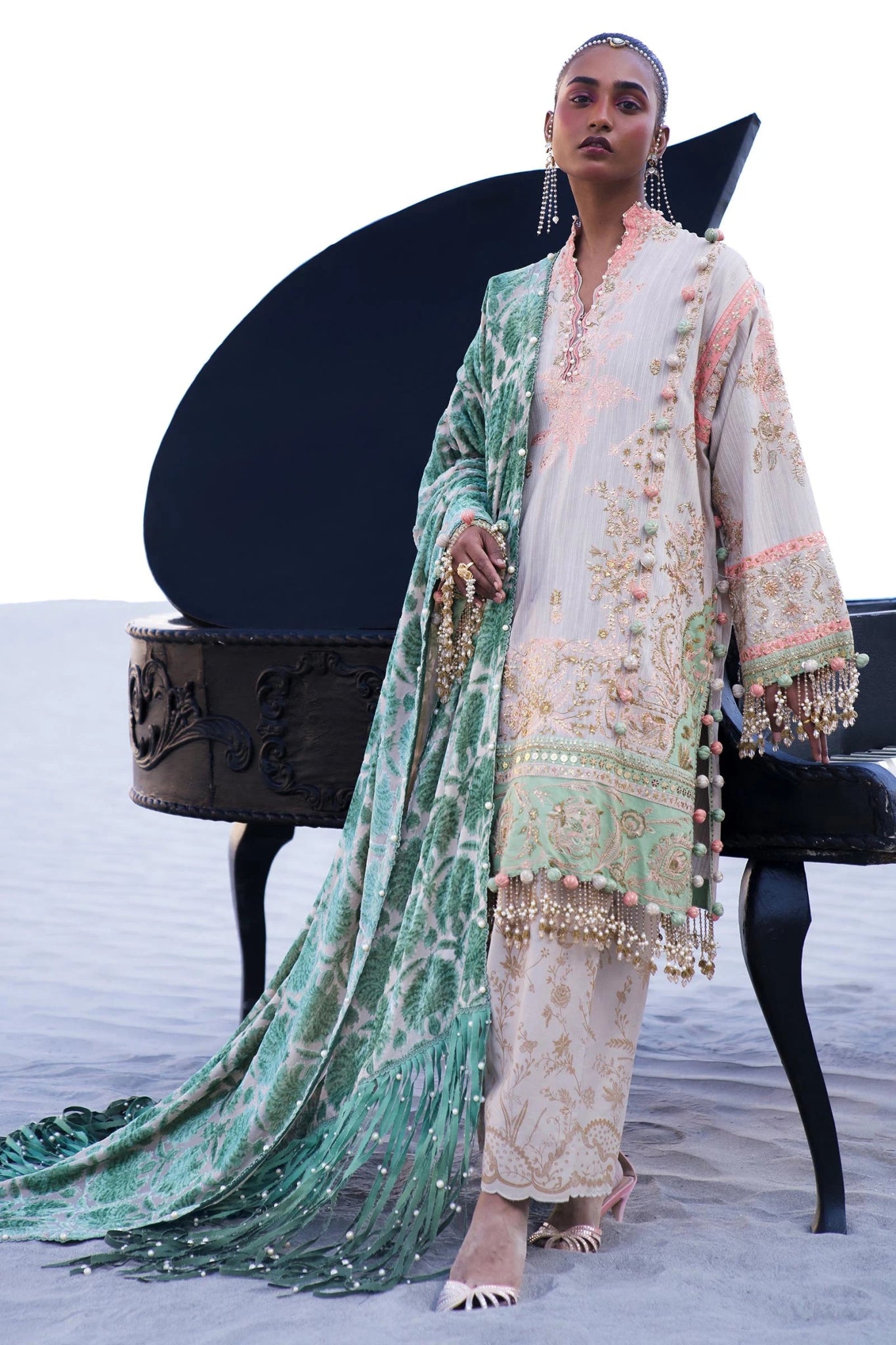 Model wearing Sana Safinaz Winter Luxury '24 S241 - 001B - 3CP, a pastel ensemble with intricate embroidery, green velvet shawl, and beaded accents. Perfect for winter, available for Pakistani clothes online in the UK.