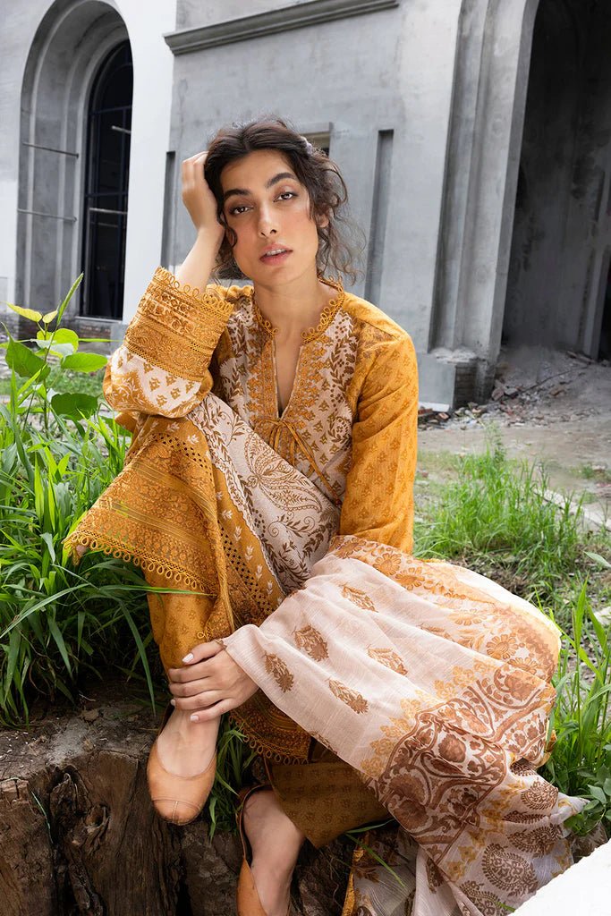 Model wearing mustard - colored Design 7B from Sobia Nazir's Fall Edit '24 collection. Pakistani winter clothes, casual pret available online in the UK.