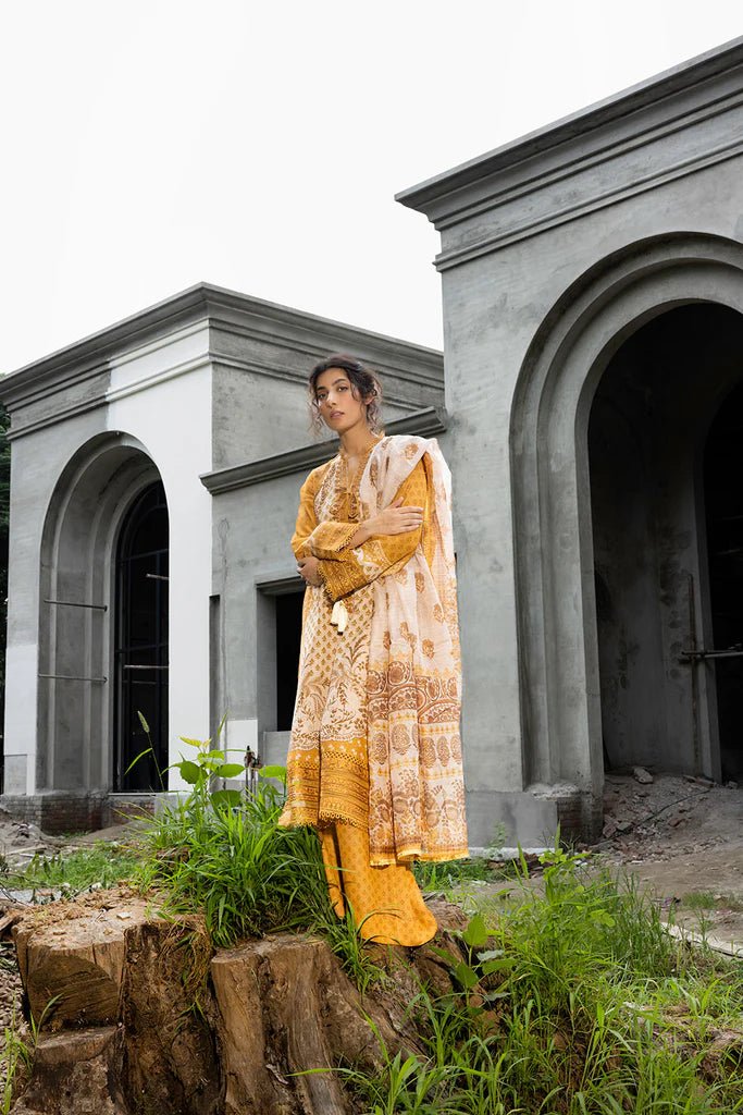 Model wearing mustard - colored Design 7B from Sobia Nazir's Fall Edit '24 collection. Pakistani winter clothes, casual pret available online in the UK.