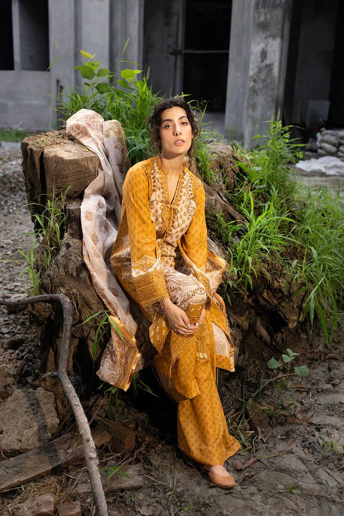 Model wearing mustard - colored Design 7B from Sobia Nazir's Fall Edit '24 collection. Pakistani winter clothes, casual pret available online in the UK.