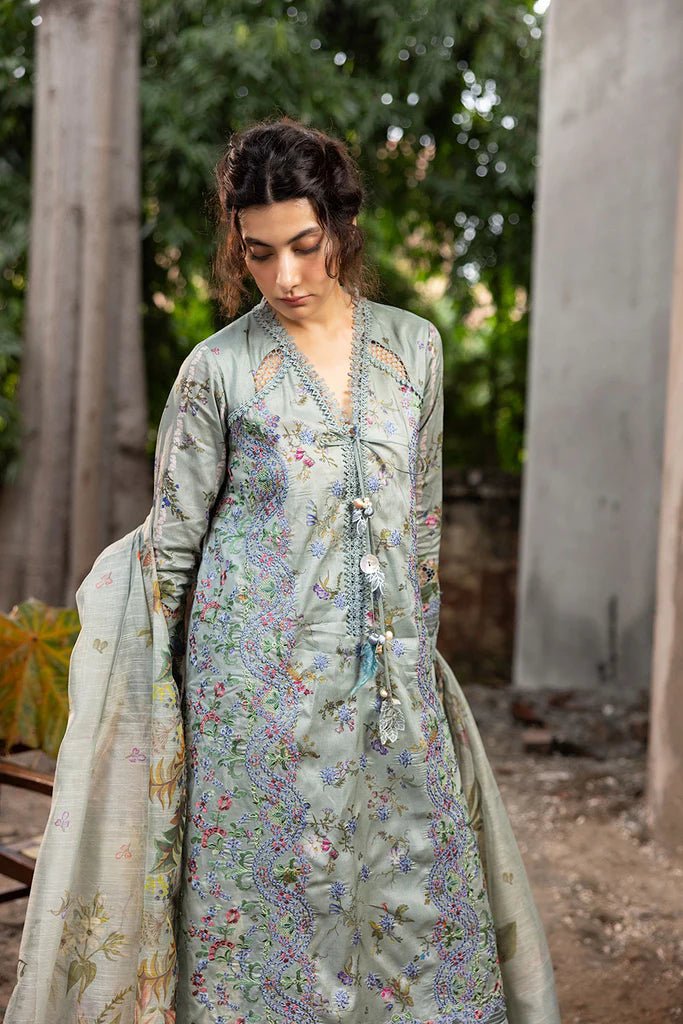 Model wearing pastel green floral embroidered Design 2A from Sobia Nazir's Fall Edit '24 collection. Pakistani winter clothes, casual pret available online in the UK.