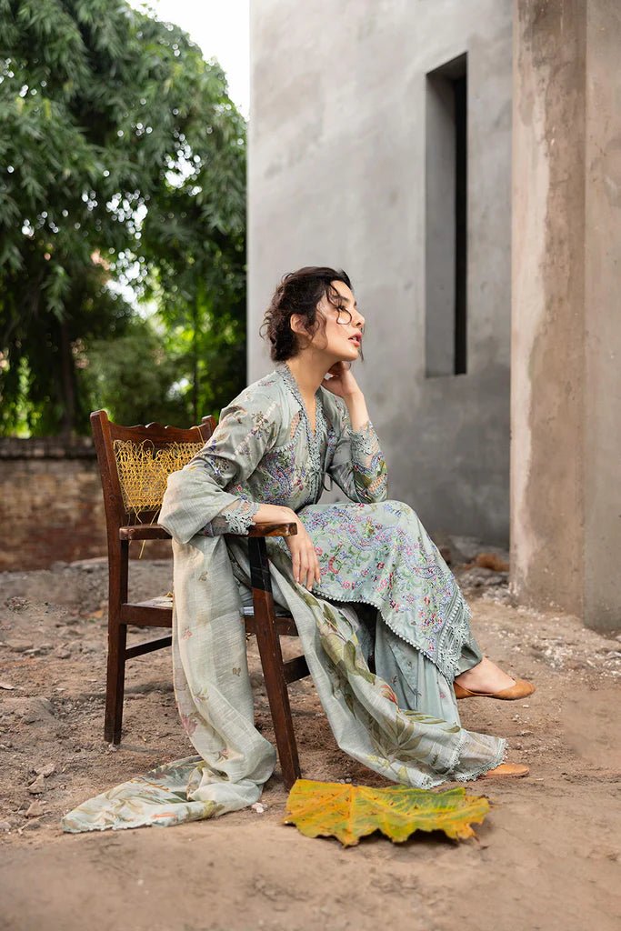 Model wearing pastel green floral embroidered Design 2A from Sobia Nazir's Fall Edit '24 collection. Pakistani winter clothes, casual pret available online in the UK.