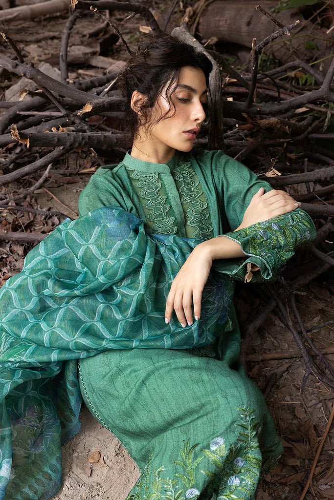 Model wearing green embroidered Design 4A from Sobia Nazir's Fall Edit '24 collection. Pakistani winter clothes, casual pret available online in the UK.