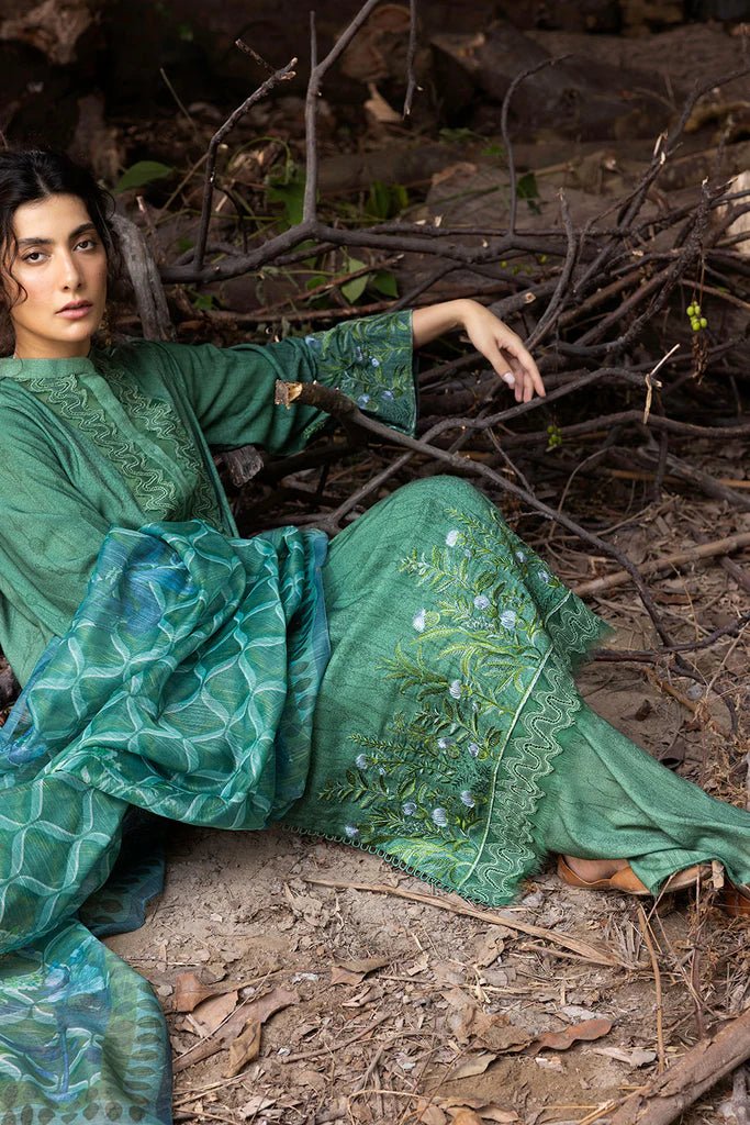 Model wearing green embroidered Design 4A from Sobia Nazir's Fall Edit '24 collection. Pakistani winter clothes, casual pret available online in the UK.