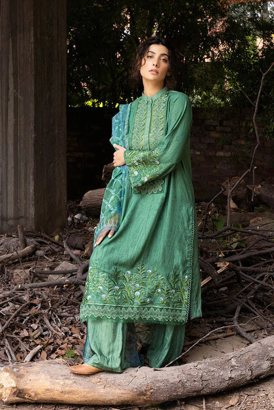 Model wearing green embroidered Design 4A from Sobia Nazir's Fall Edit '24 collection. Pakistani winter clothes, casual pret available online in the UK.