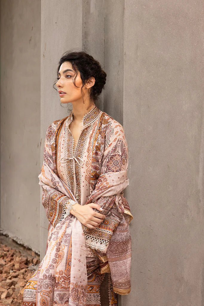 Model wearing beige and brown embroidered Design 5B from Sobia Nazir's Fall Edit '24 collection. Pakistani winter clothes, casual pret available online in the UK.