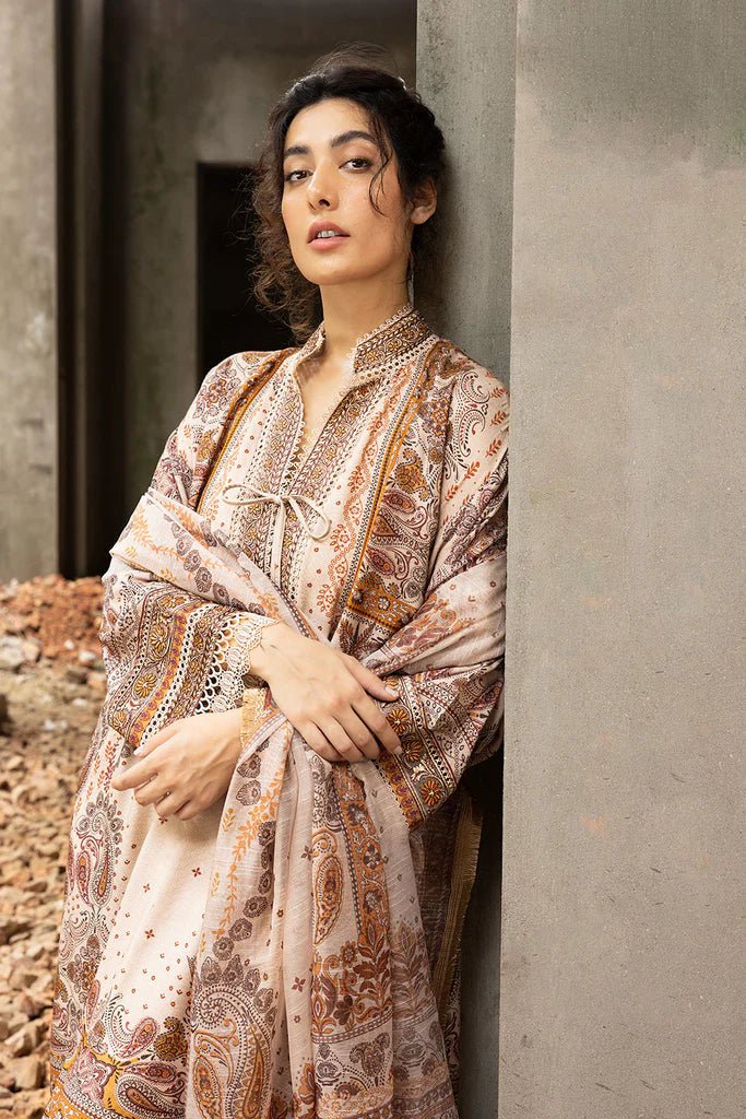 Model wearing beige and brown embroidered Design 5B from Sobia Nazir's Fall Edit '24 collection. Pakistani winter clothes, casual pret available online in the UK.