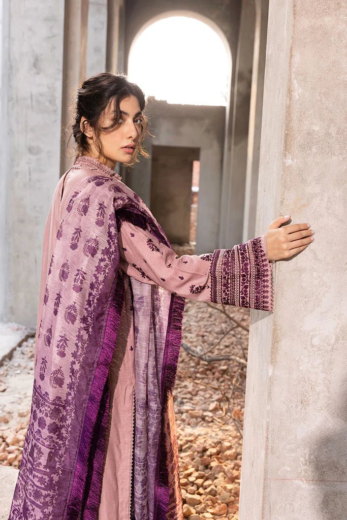 Model wearing Sobia Nazir Fall Edit '24 Design 7B, featuring a purple outfit with intricate embroidery, perfect for winter casual pret. Available online in the UK.